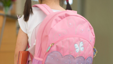 photo of little girl with a pink backpack